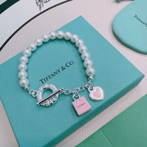 Tiffany & Co. pink and silver color scheme with heart-shaped beads Bracelet